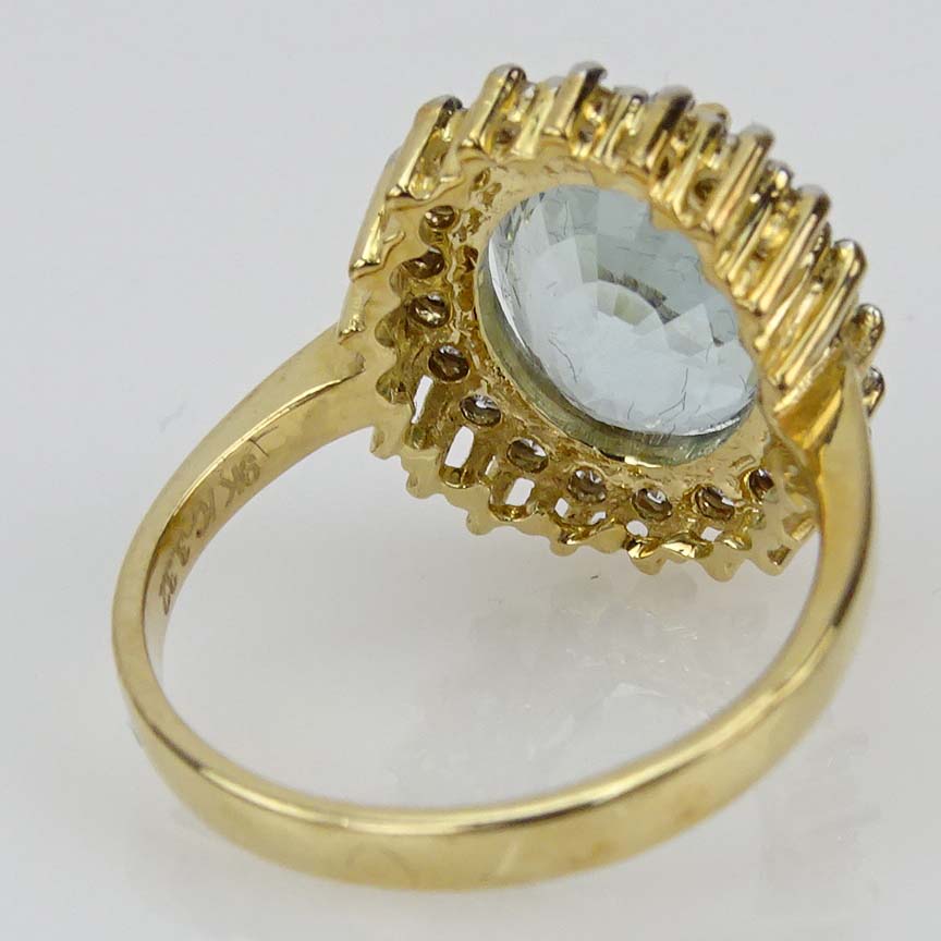 Contemporary 3.32 Carat Oval Cut Aquamarine, Diamond and 9 Karat Yellow Gold Ring. 