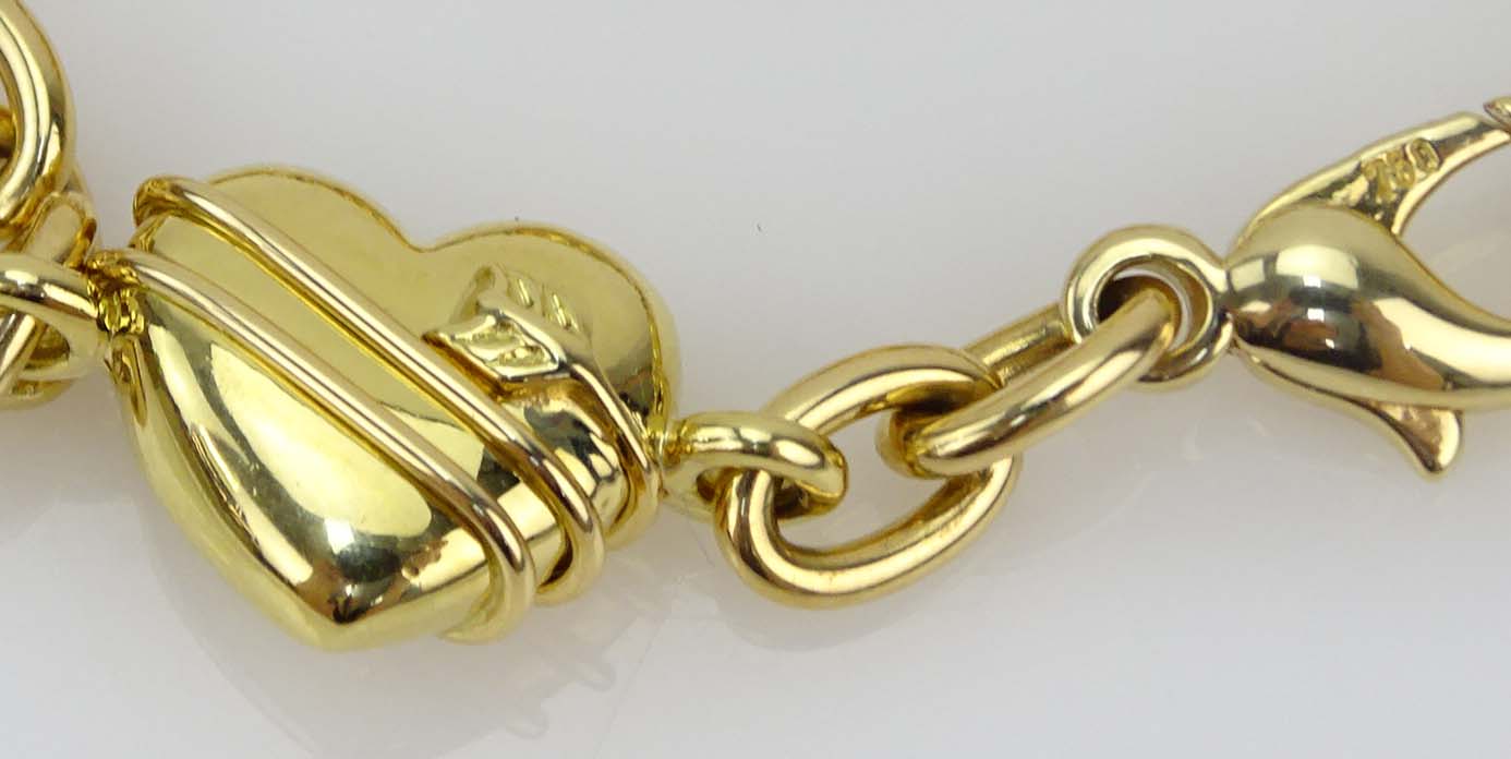 Tiffany & Co 18 Karat Yellow Gold Four Hearts Charm Bracelet.