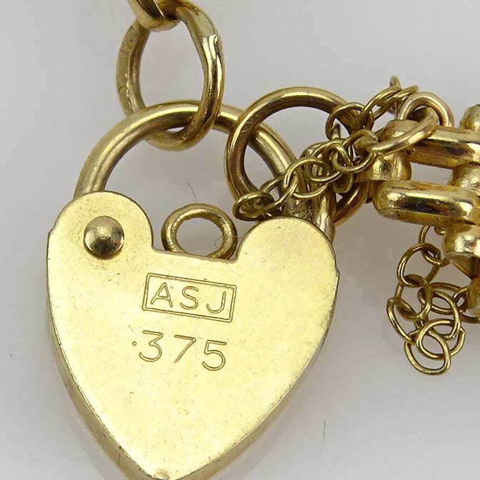 Vintage 14 Karat Yellow Gold Link Bracelet and Vintage 10 Karat Yellow Gold Link Bracelet with Heart Locket Clasp.