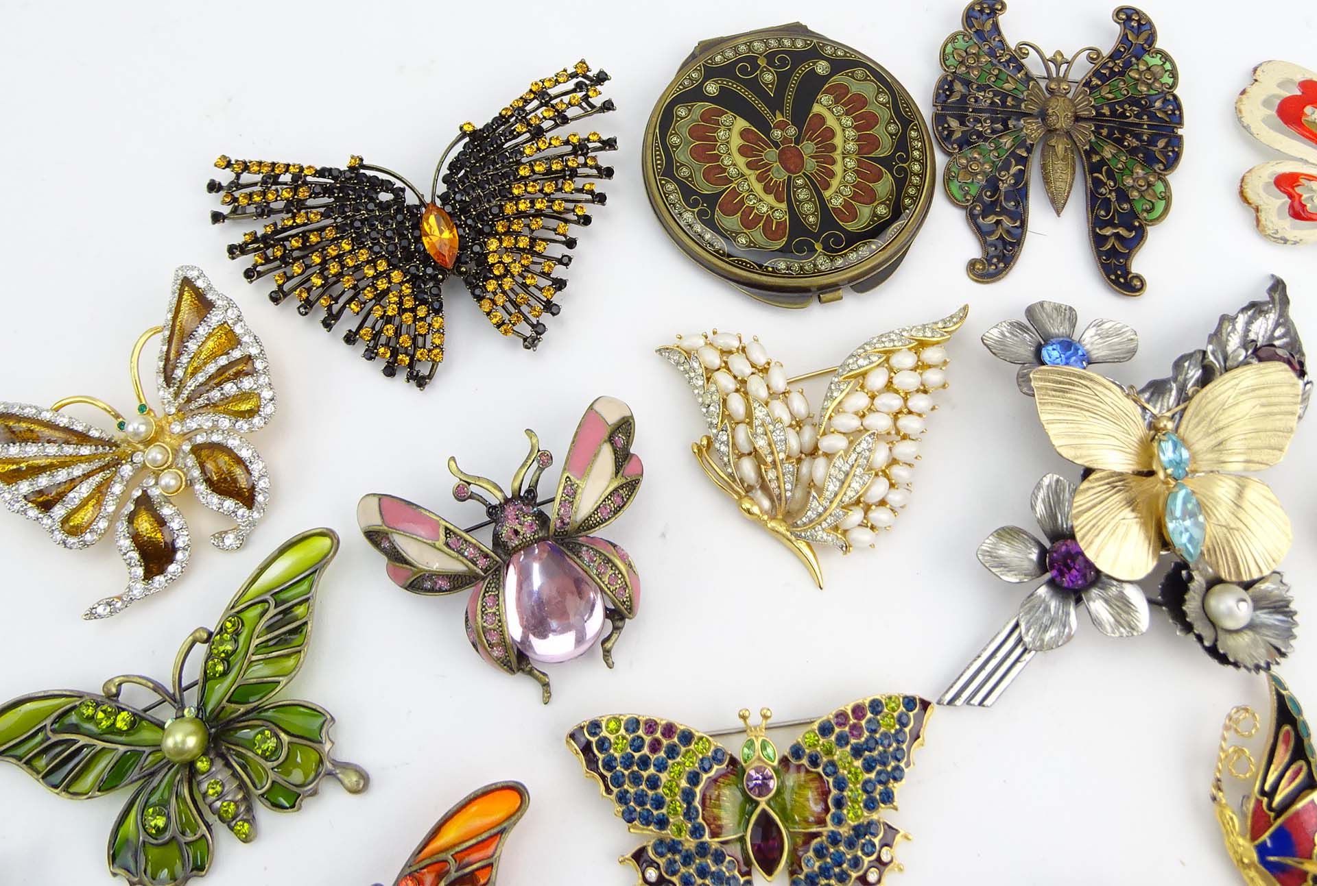 Collection of Fifteen (15) Fashion Butterfly Brooches and One (1) Compact variously with enamel and faux gem stones.