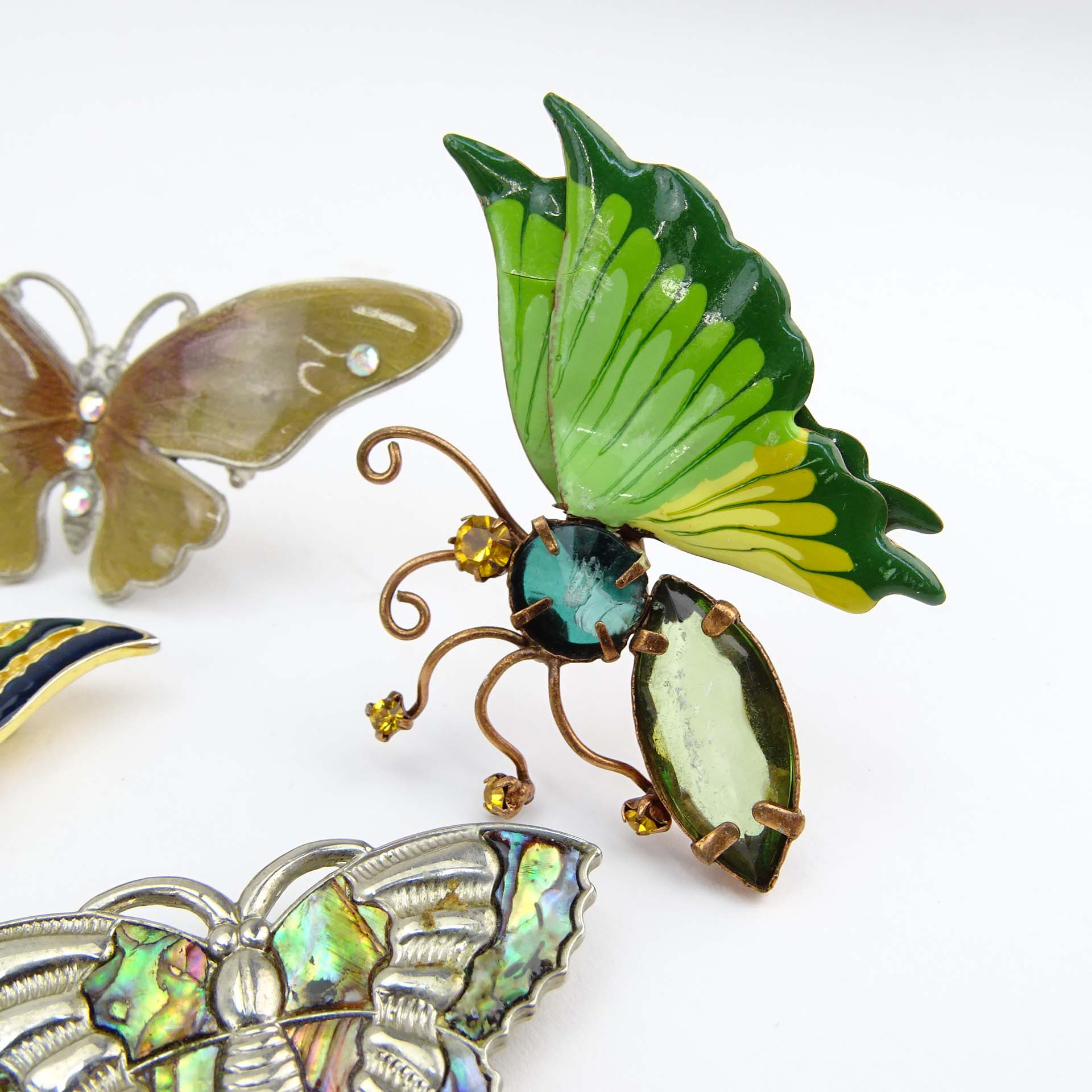 Collection of Fifteen (15) Fashion Butterfly Brooches decorated variously with enamel and faux gem stones.