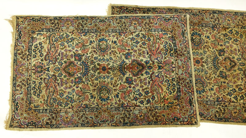 Pair of Semi Antique Kerman Rugs. Mainly tan with multi color floral motif.