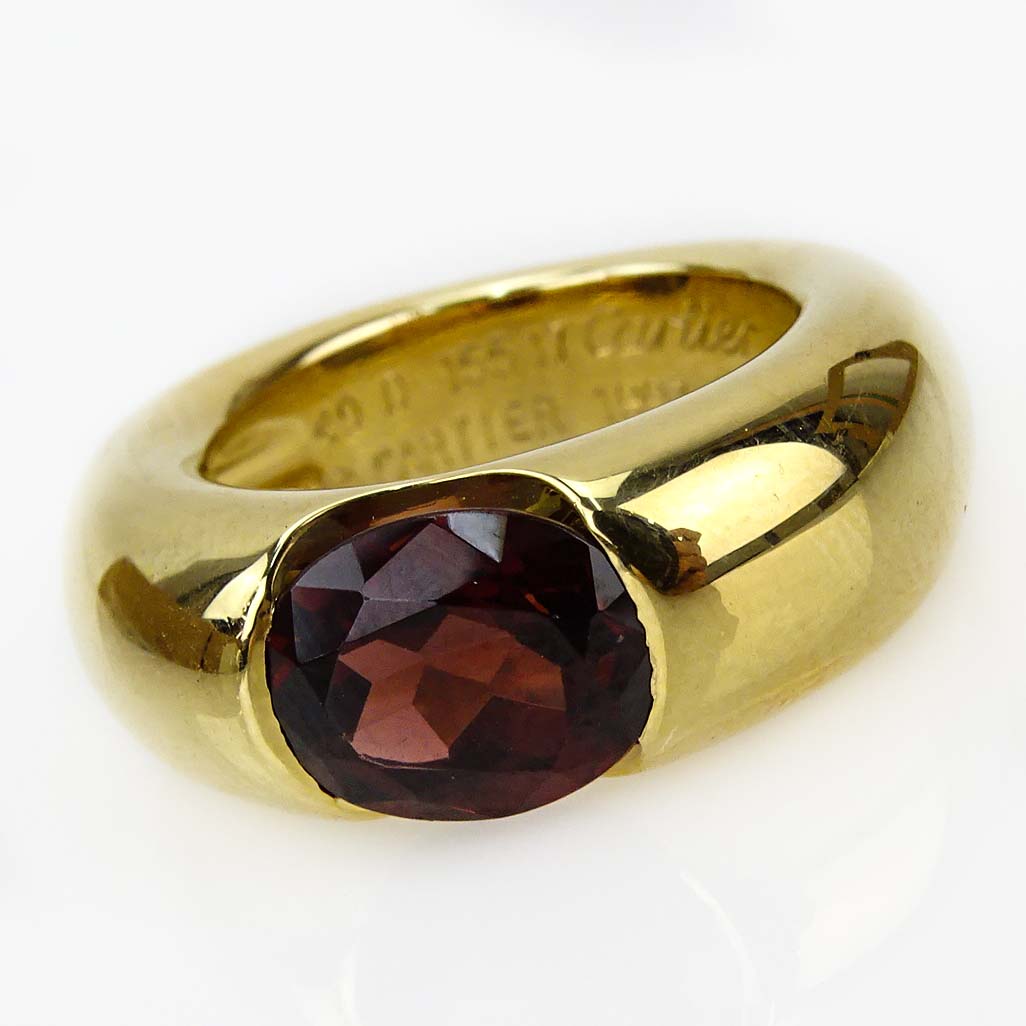 Cartier 18 Karat Yellow Gold and Approx. 3.0 Carat Oval Cut Garnet Ring.