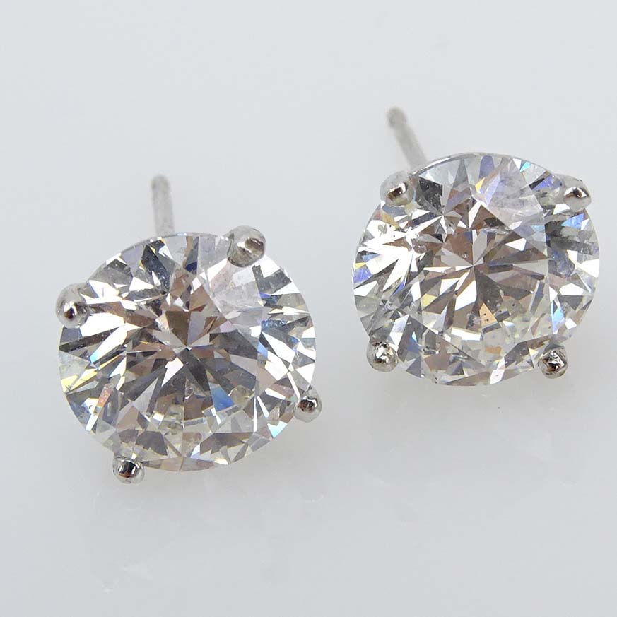 GIA Certified 6.02 Carat TW Round Brilliant Cut Diamond and 18 Karat White Gold Ear Studs.