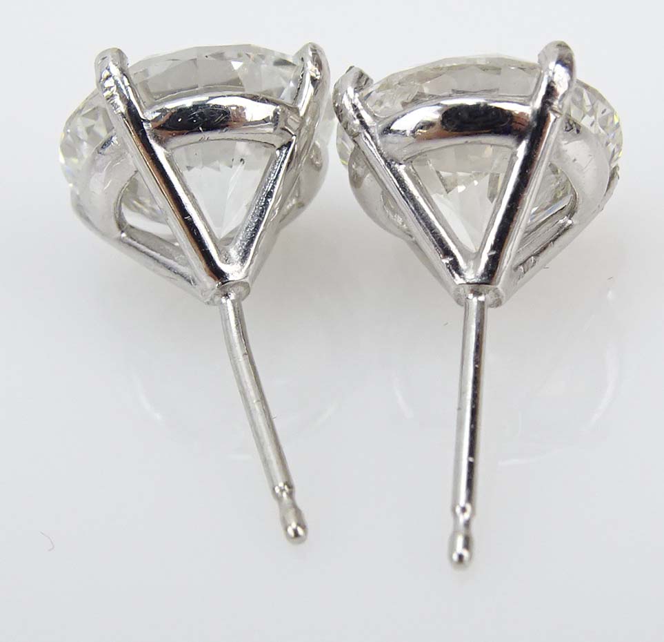 GIA Certified 6.02 Carat TW Round Brilliant Cut Diamond and 18 Karat White Gold Ear Studs.