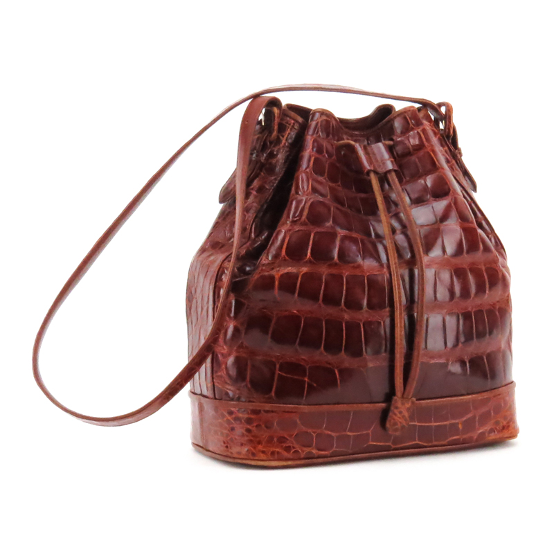 Lana Marks Russet Crocodile Drawstring Bucket Bag. Suede Interior with zipper pocket.