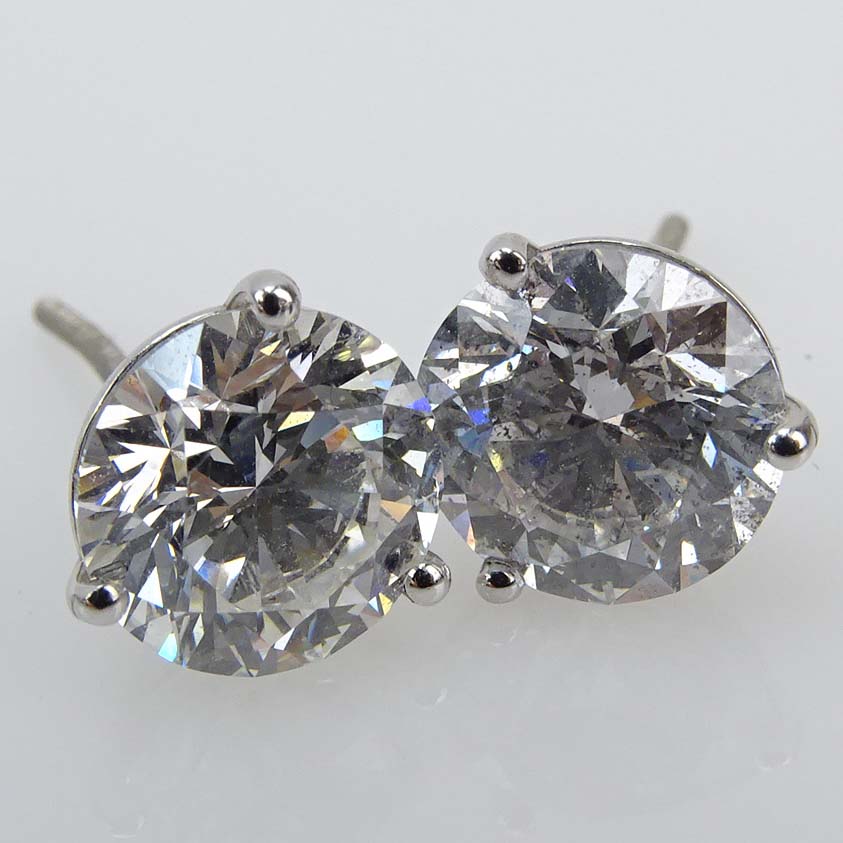 GIA Certified 4.04 Carat TW Round Brilliant Cut Diamond and 18 Karat White Gold Ear Studs.