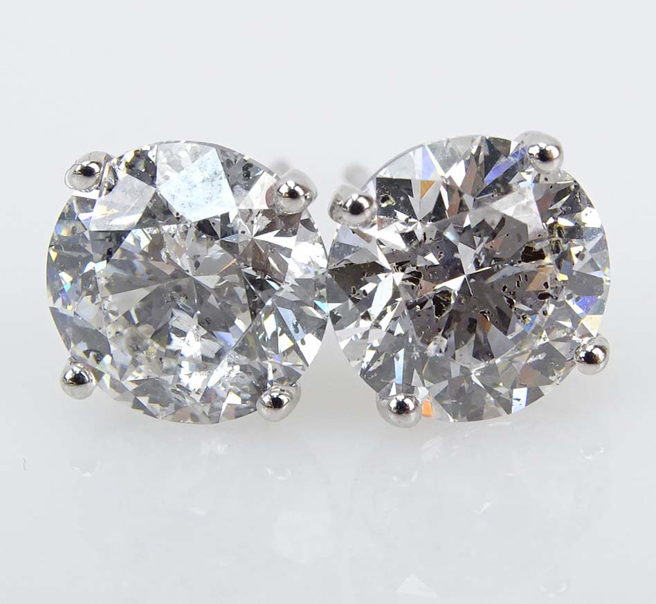 GIA Certified 4.70 Carat TW Round Brilliant Cut Diamond and 18 Karat White Gold Ear Studs.