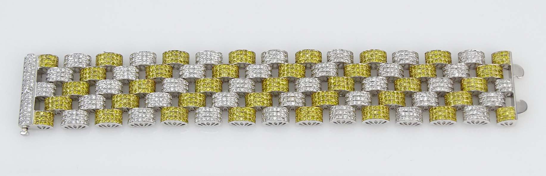 Contemporary Approx. 10.50 Carat Pave Set Fancy Intense Yellow Diamond, 11.50 Carat Pave Set Round Brilliant Cut Diamond and 18 Karat White Gold Link Bracelet. 