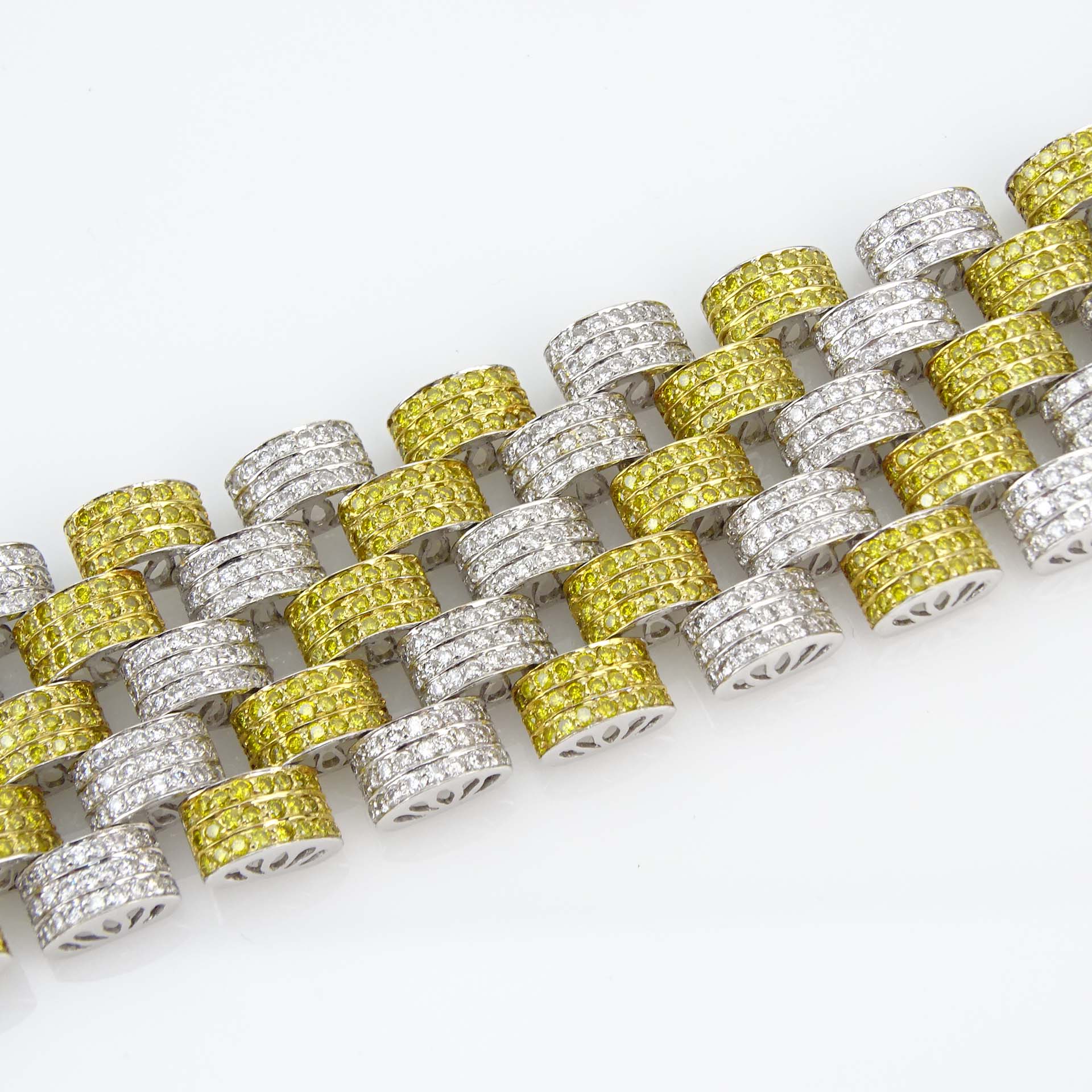 Contemporary Approx. 10.50 Carat Pave Set Fancy Intense Yellow Diamond, 11.50 Carat Pave Set Round Brilliant Cut Diamond and 18 Karat White Gold Link Bracelet. 