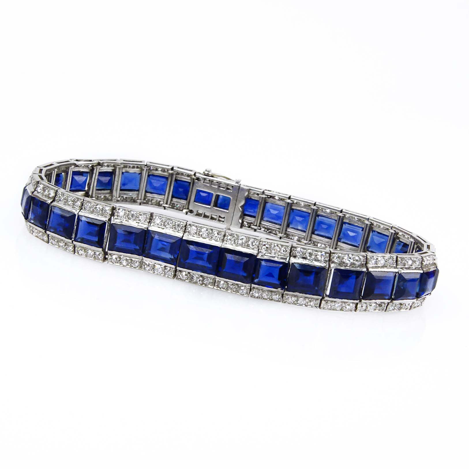 GIA Certified Art Deco 22.0 Carat Unheated Cut Burma Sapphire, 3.50 Carat Diamond and Platinum Bracelet. Superb quality sapphires with vivid saturation of color. 