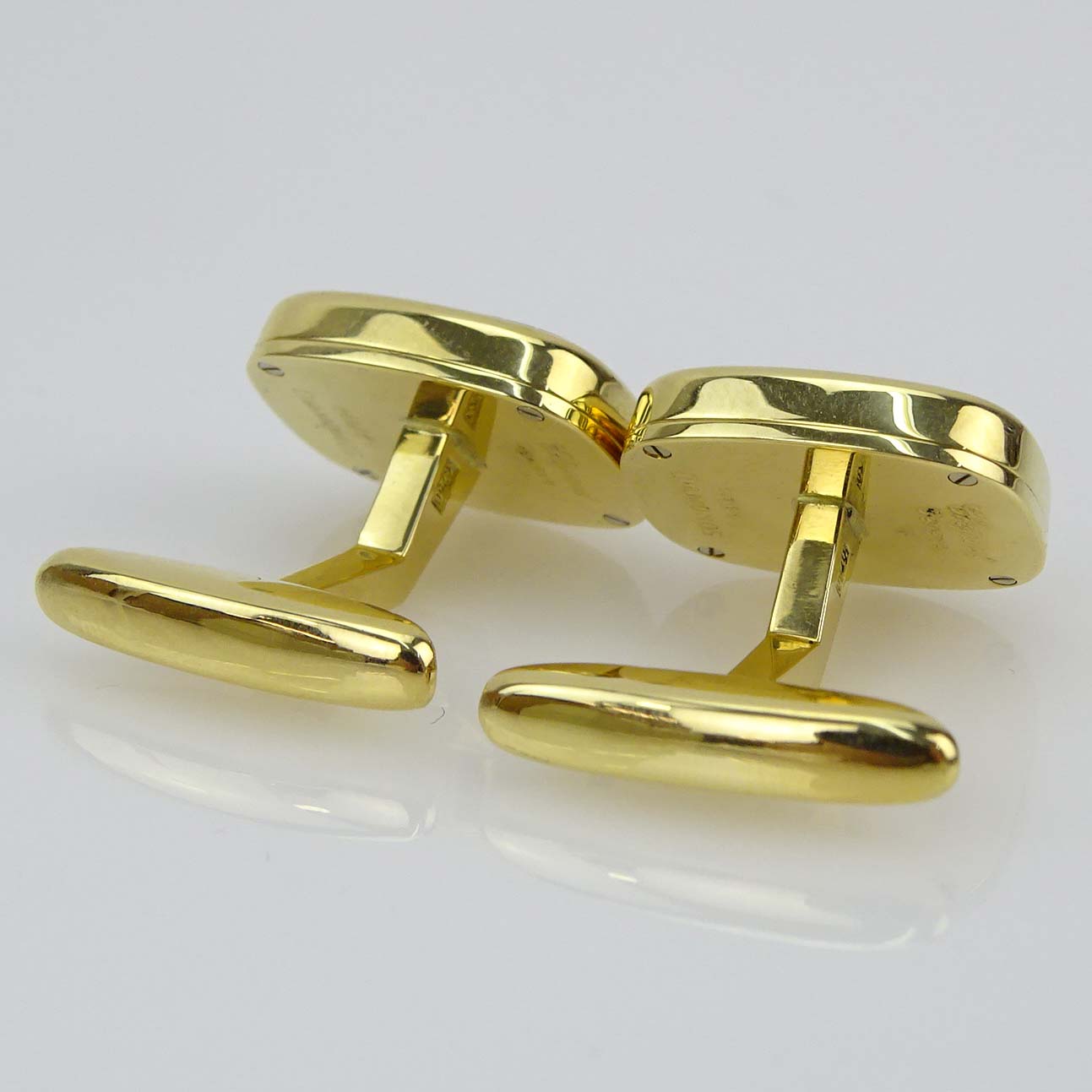 Chopard 18 Karat Yellow Gold, Approx. .50 Carat Diamond and Black Onyx Happy Diamonds Cuff Links.