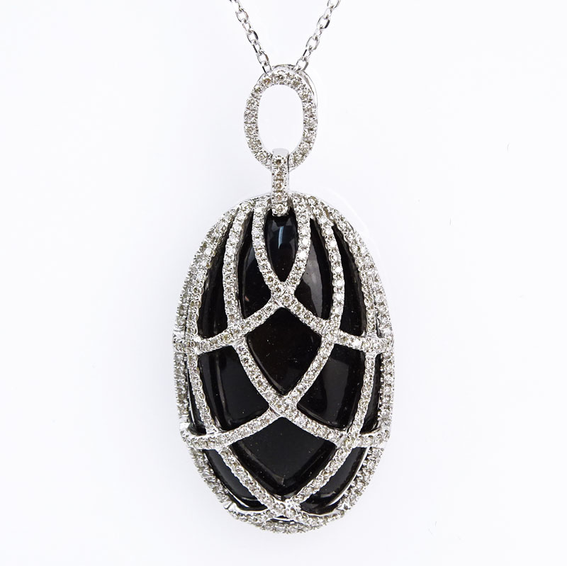 Approx. 19.20 Carat Oval Cabochon Black Onyx, .65 Carat Diamond and 14 Karat White Gold Pendant Necklace. 