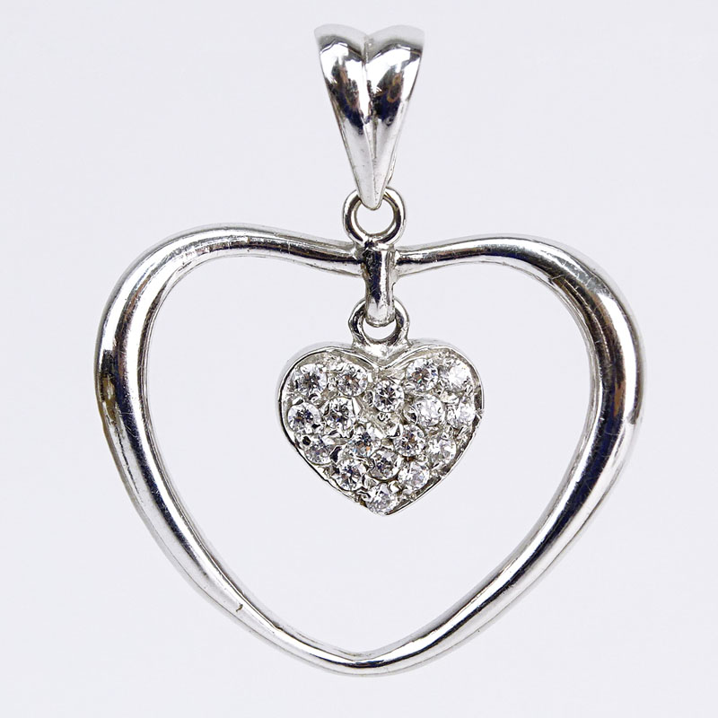 14 Karat White Gold and Diamond Heart Pendant.