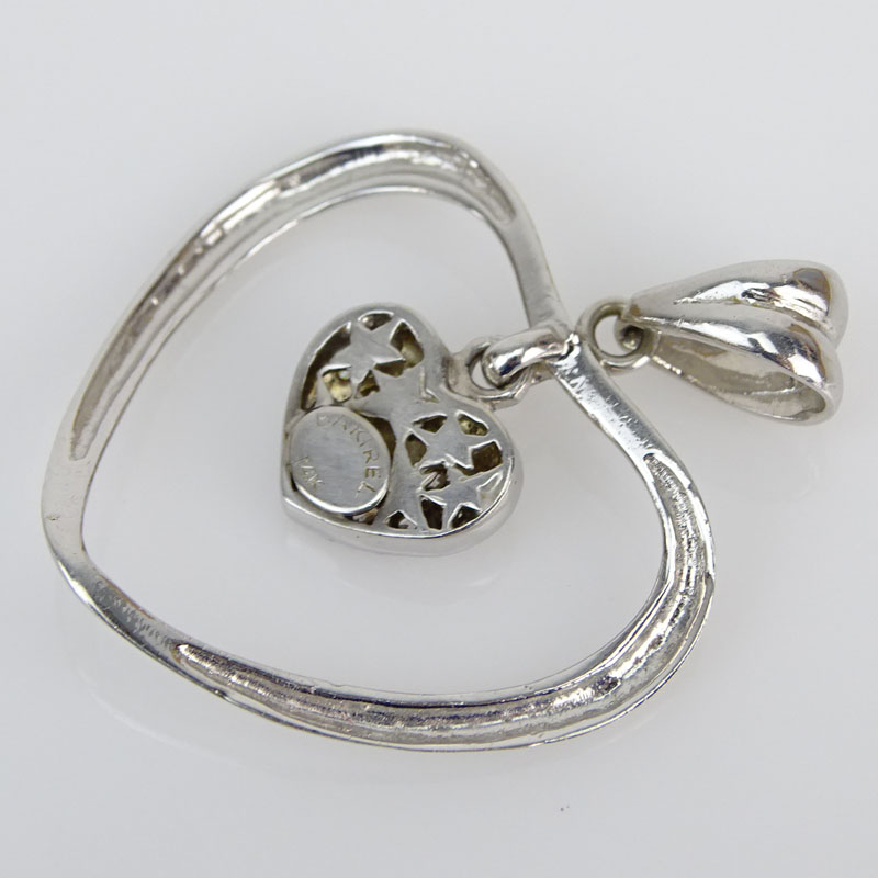 14 Karat White Gold and Diamond Heart Pendant.