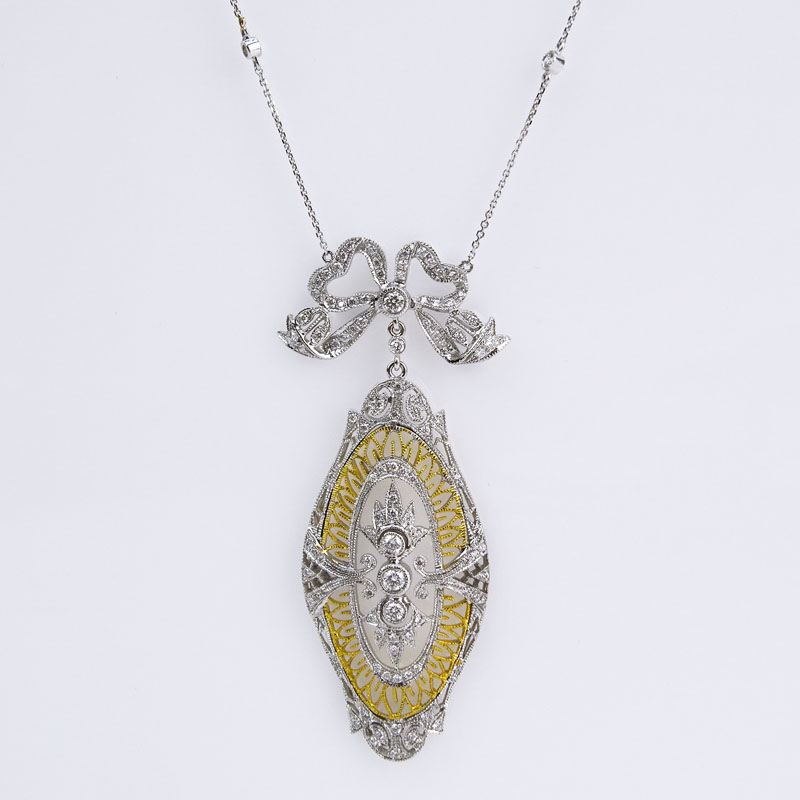 Antique style Approx. 1.0 Carat Diamond and 14 Karat Yellow and White Gold Pendant Necklace.