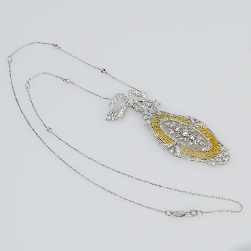 Antique style Approx. 1.0 Carat Diamond and 14 Karat Yellow and White Gold Pendant Necklace.