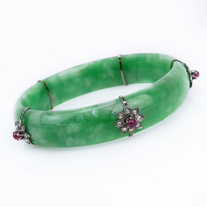 Approx. .80 Carat Diamond, 1.30 Carat Cabochon Ruby and 14 Karat White Gold Mounted Jadeite Bangle Bracelet. 