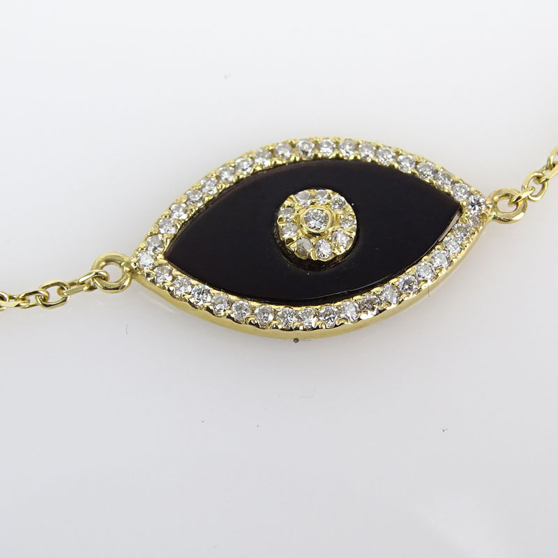 Approx. .85 Carat Diamond, Black Onyx and 14 Karat Yellow Gold Bracelet. 