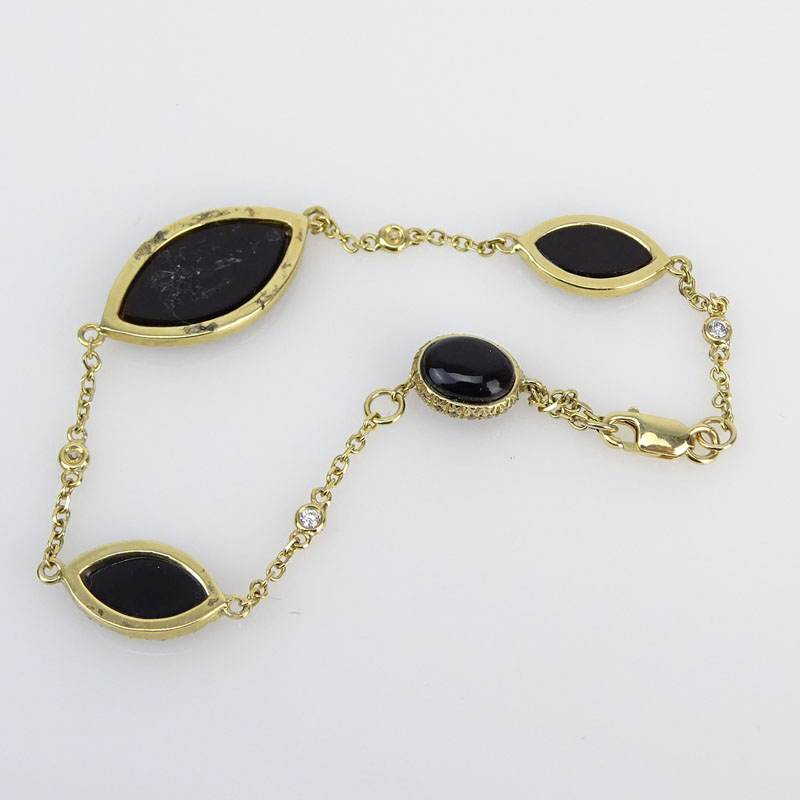 Approx. .85 Carat Diamond, Black Onyx and 14 Karat Yellow Gold Bracelet. 