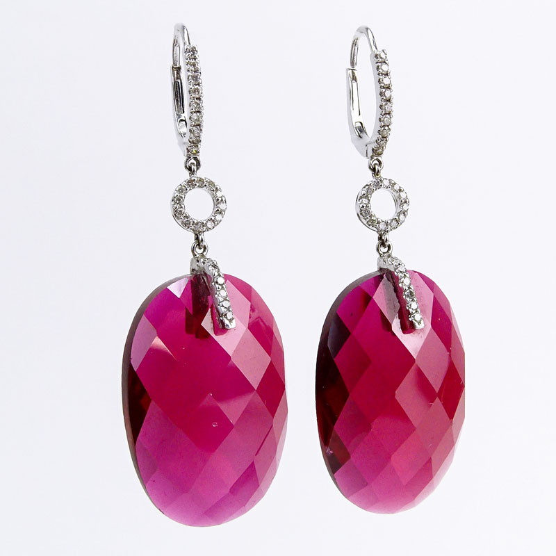 Approx. .50 Carat Diamond, Red Stone and 14 Karat White Gold Fashion Pendant earrings. 