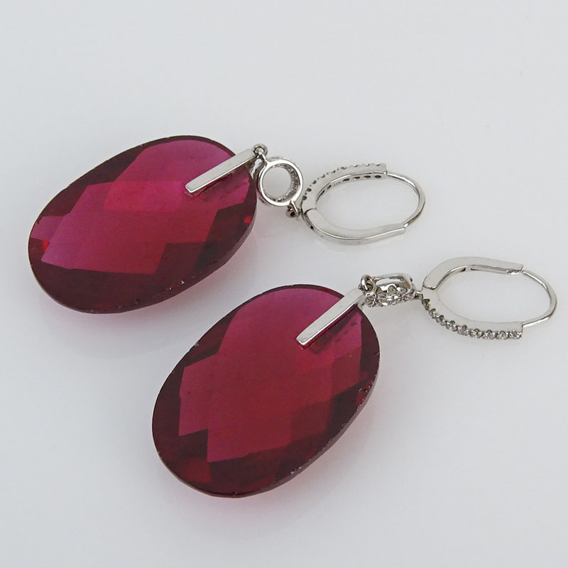 Approx. .50 Carat Diamond, Red Stone and 14 Karat White Gold Fashion Pendant earrings. 