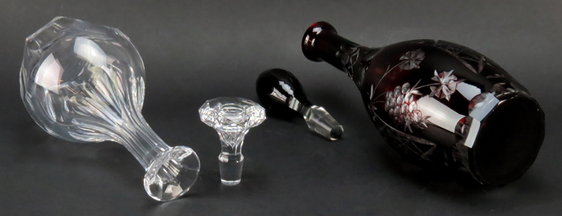 Grouping of Two (2) Vintage Decanters. Includes: Baccarat "Malmaison" decanter and Bohemian cranberry to clear decanter.