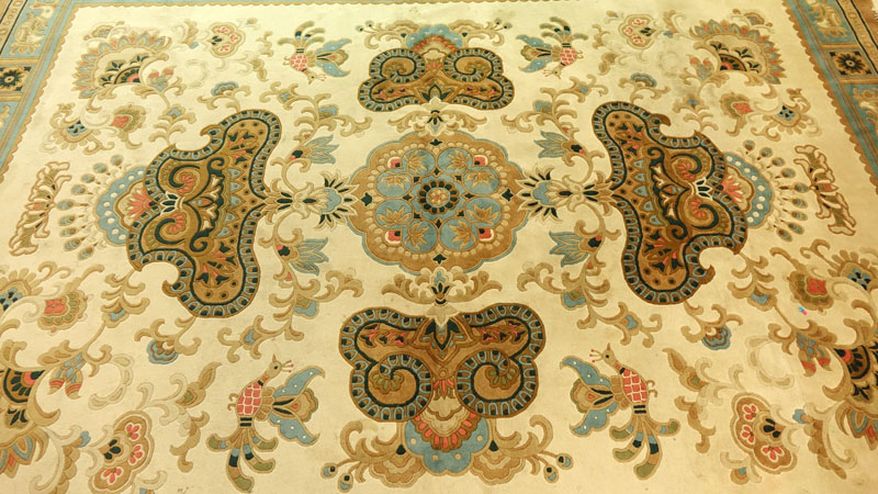 Semi Antique French Aubusson Rug. Multi color with floral and bird motif.