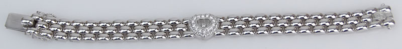 Chopard Approx. .80 Carat Round Brilliant Cut Diamond and 18 Karat White Gold Happy Diamond Heart, Three Row Panther Link Bracelet. 