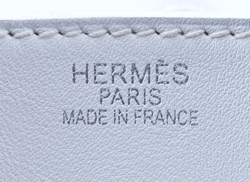 Hermès White Swift Leather Birkin 35 Bag. Palladium hardware. Interior with zipper and slot pocket. Clochette, keys and lock included as well as dust bag. 