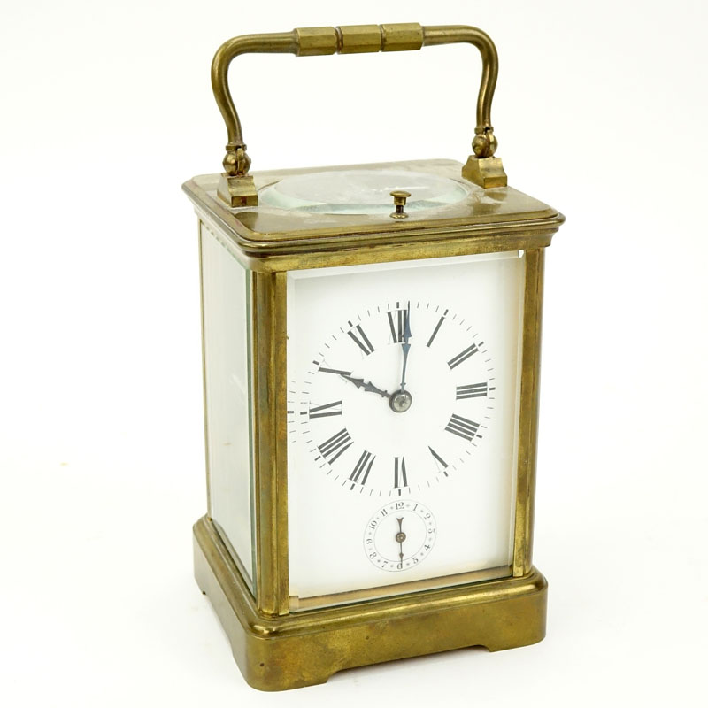 Late 19th Century French Aiguilles Gilt Brass Carriage Clock. Porcelain dial with double display, Roman and Arabic numerals. 