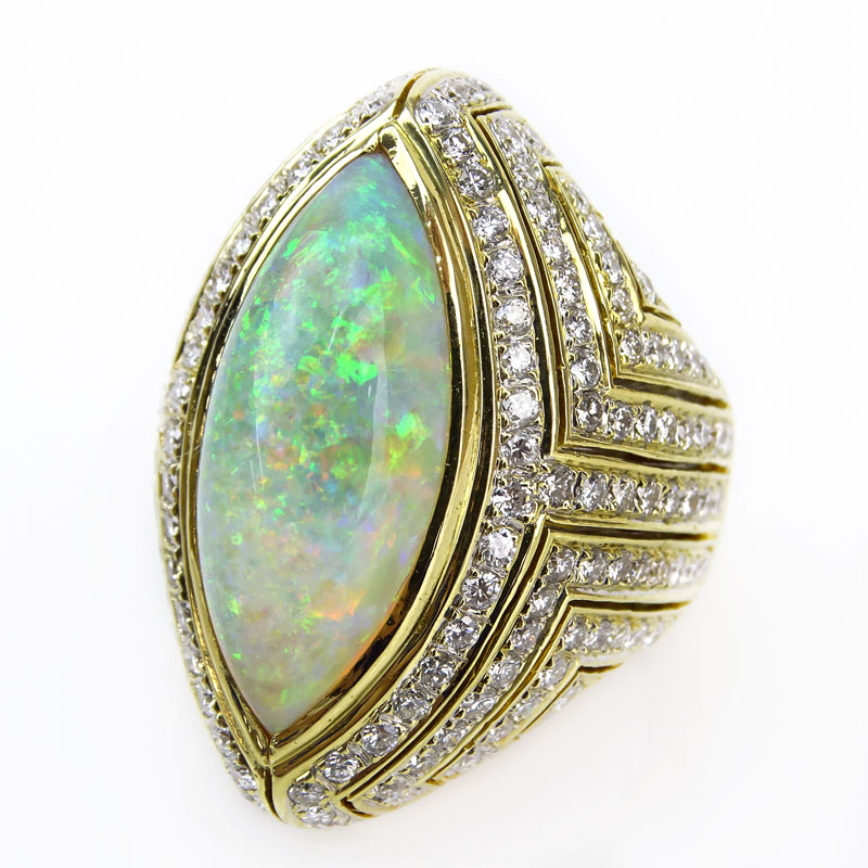 Approx. 10.0 Carat Marquise Cut Opal, 3.0 carat Pave Set Round Brilliant Cut Diamond and 18 Karat Yellow Gold Ring. 