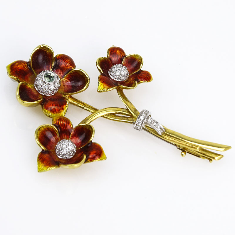 Approx. 1.10 Carat Pave Set Round Brilliant Cut Diamond, .20 Carat Green Sapphire, Enamel and 18 Karat yellow Gold Flower Brooch. 