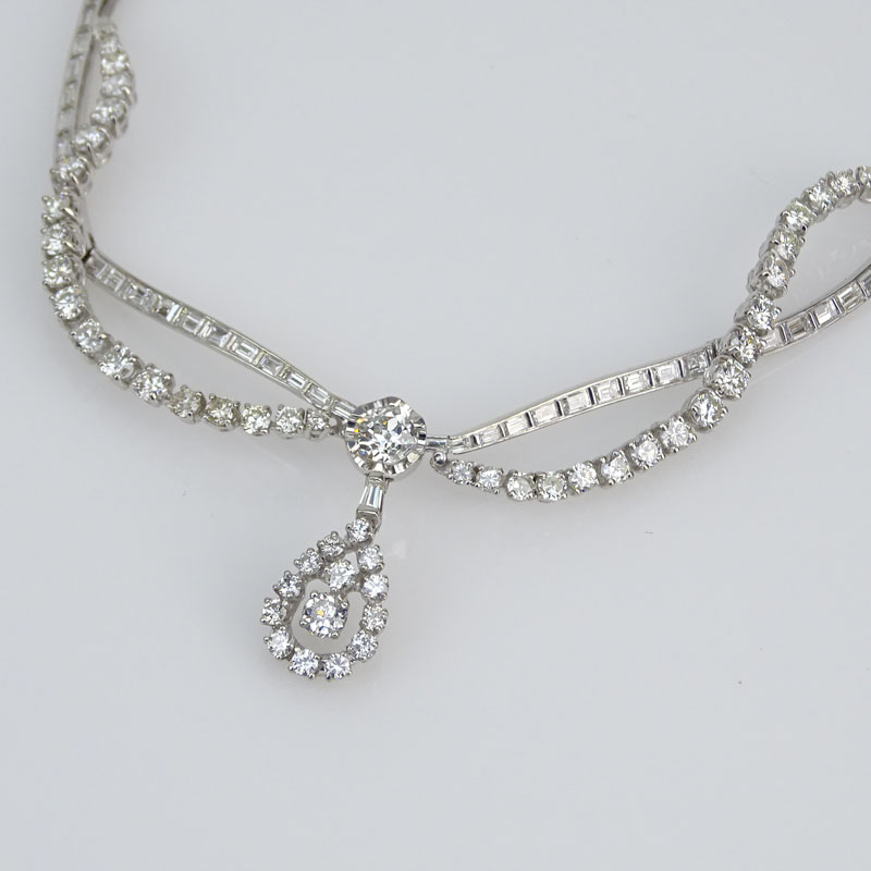 Approx. 16.0 Carat Round Brilliant and Baguette Cut Diamond and Platinum Pendant Necklace.