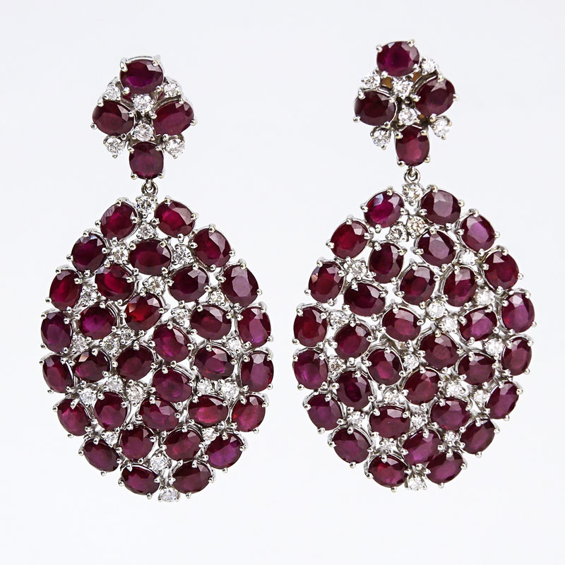 Contemporary Approx. 37.53 Carat Oval Cut Ruby, 2.05 Carat Round Brilliant Cut Diamond and 18 Karat White Gold Pendant Earrings. 