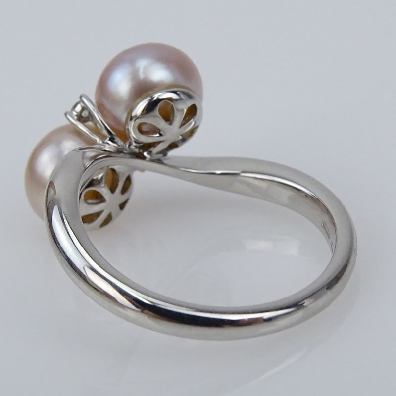 18 Karat White Gold, Pearl and Diamond Cross Over Ring. 