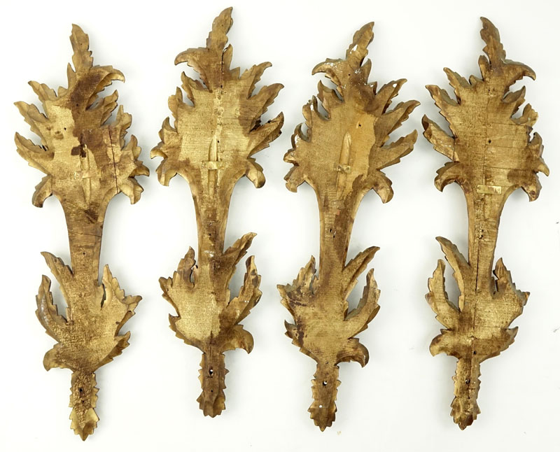Set of Four (4) Carved Gilt Wood Wall Appliques.