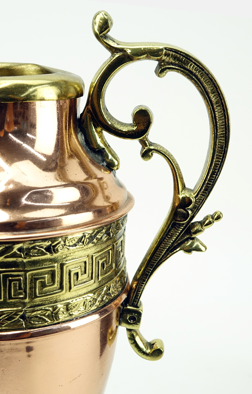 Pair of Continental Style Copper and Brass Urns on Wooden Stands.