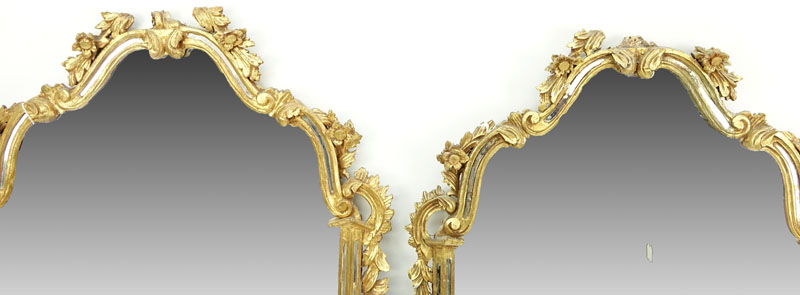 Pair of mid 20th Century Italian Carved and Giltwood Mirrors.