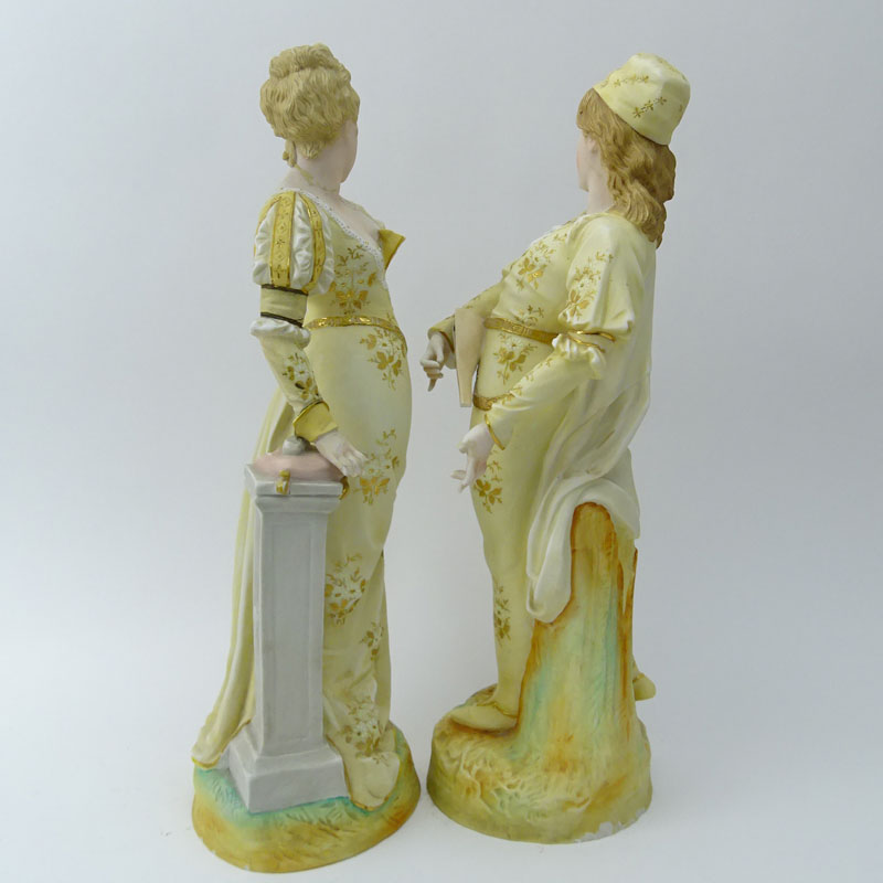 Two (2) Porcelain Figurines. Man & Woman in costume.