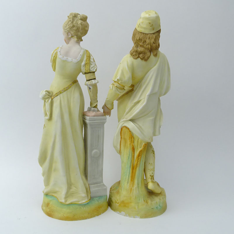 Two (2) Porcelain Figurines. Man & Woman in costume.