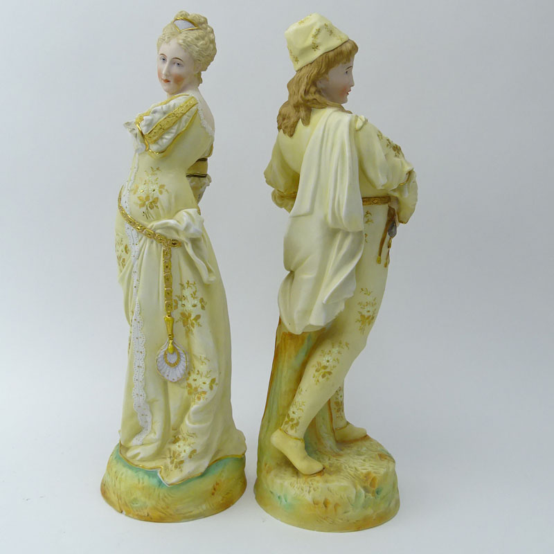 Two (2) Porcelain Figurines. Man & Woman in costume.