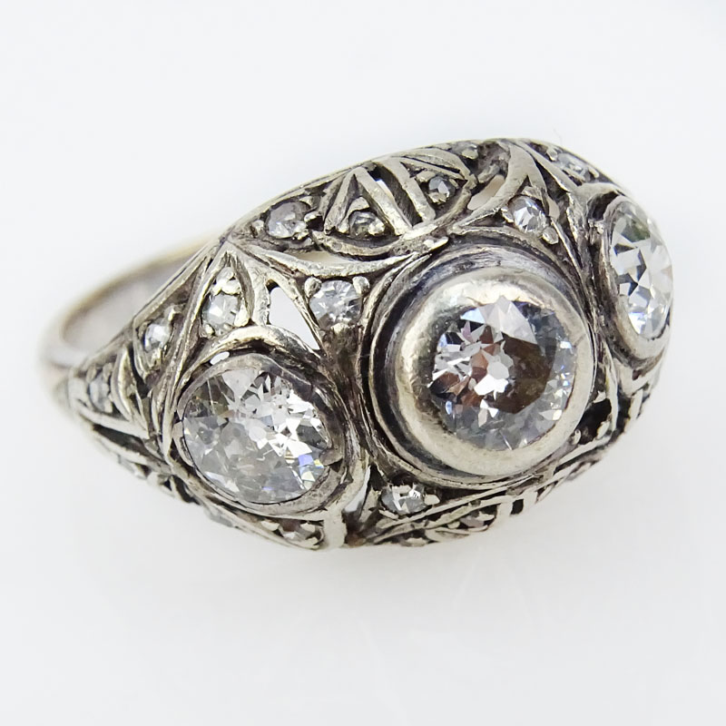 Art Deco Old European Cut Diamond and 14 Karat White Gold Filigree Three Stone Dome Ring.