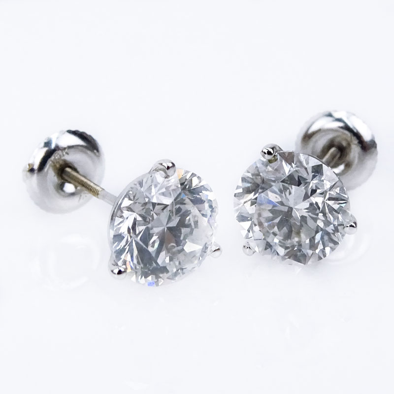 GIA Certified 4.24 Carat Round Brilliant Cut Diamond and 18 Karat White Gold Ear studs.