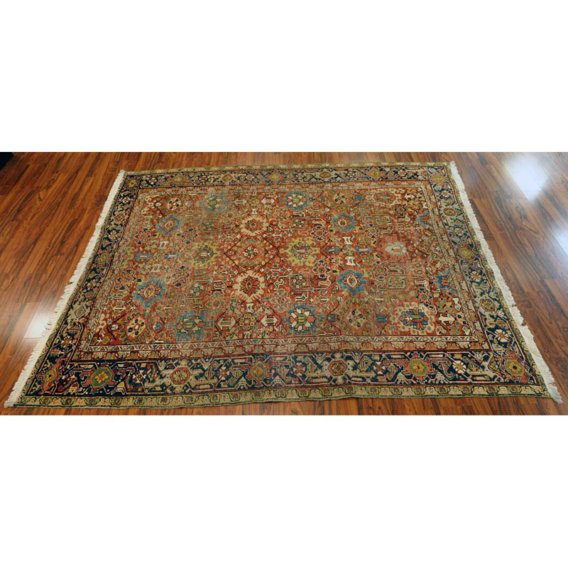 Large Semi Antique Heriz Rug. Worn, some discoloration, dirty, and has been re-fringed.