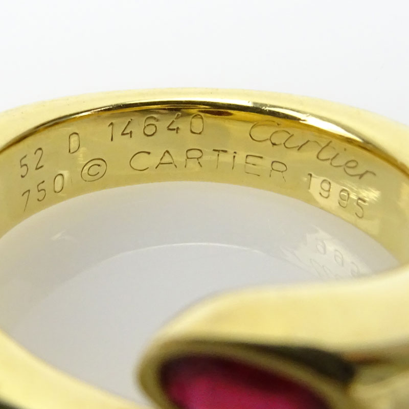 Vintage Cartier Approx. 1.20 Carat Oval Cut Ruby and 18 Karat Yellow Gold Ellipse Deux Tetes Croisees Bypass Ring.