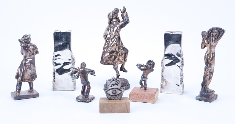 Collection of Eight (8) Judaica Silver Clad Figurines and Candlesticks.