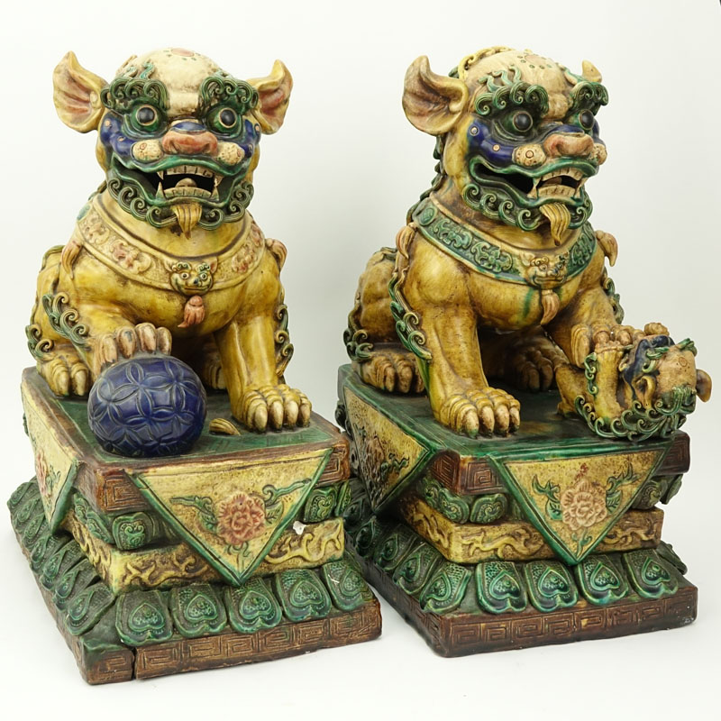 Pair of Large Chinese Polychrome Pottery Foo Dogs.