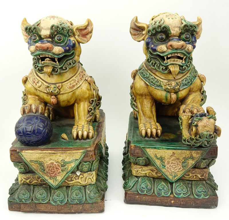 Pair of Large Chinese Polychrome Pottery Foo Dogs.