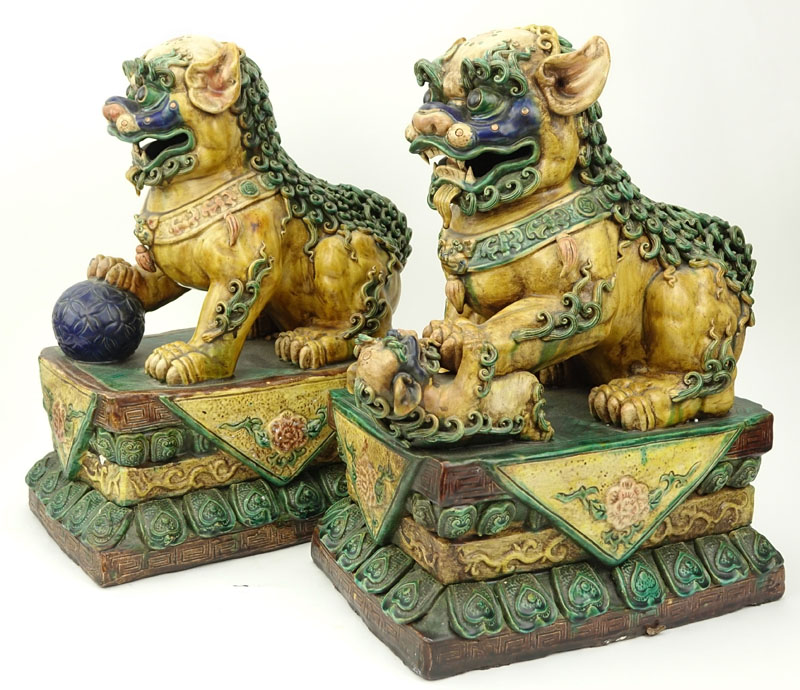 Pair of Large Chinese Polychrome Pottery Foo Dogs.